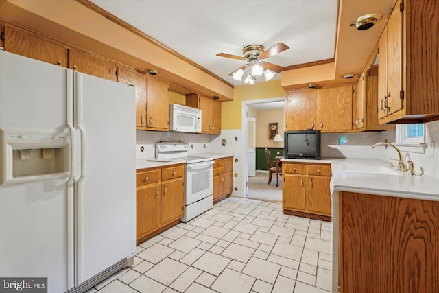 711 Pikeland Ave, Spring City, PA 19475 - kitchen featuring white appliances, a sink, a ceiling fan, light countertops, and backsplash