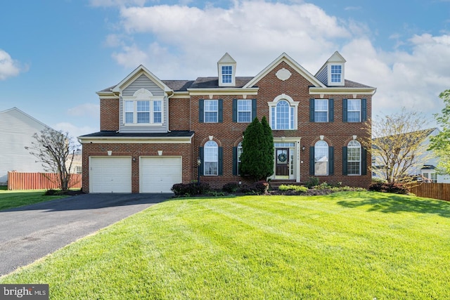10000 Umbrella Pl, Nokesville, VA 20181 - colonial-style house featuring asphalt driveway, a garage, and brick siding