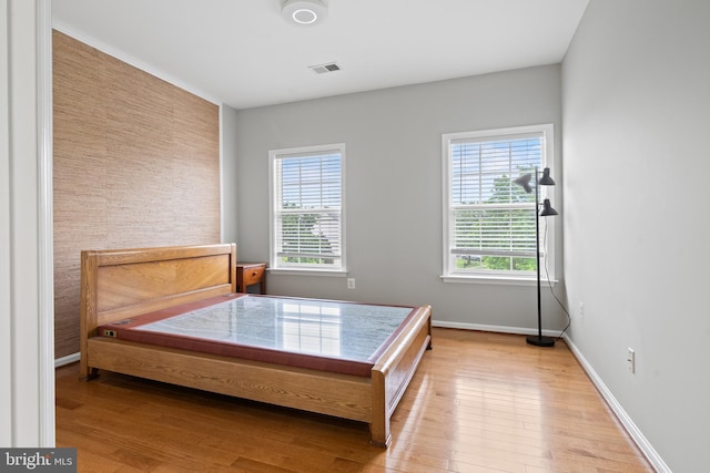 10000 Umbrella Pl, Nokesville, VA 20181 - bedroom with multiple windows, wood finished floors, and baseboards