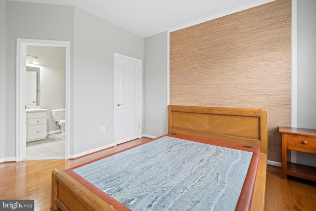 10000 Umbrella Pl, Nokesville, VA 20181 - bedroom featuring wood finished floors, baseboards, and ensuite bathroom