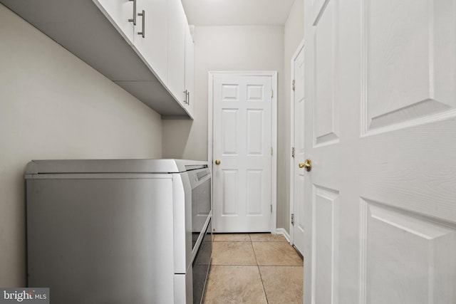 10000 Umbrella Pl, Nokesville, VA 20181 - laundry room with cabinet space, separate washer and dryer, and light tile patterned flooring