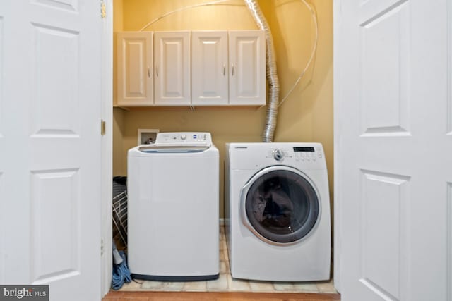 10000 Umbrella Pl, Nokesville, VA 20181 - laundry room featuring washer and clothes dryer and cabinet space
