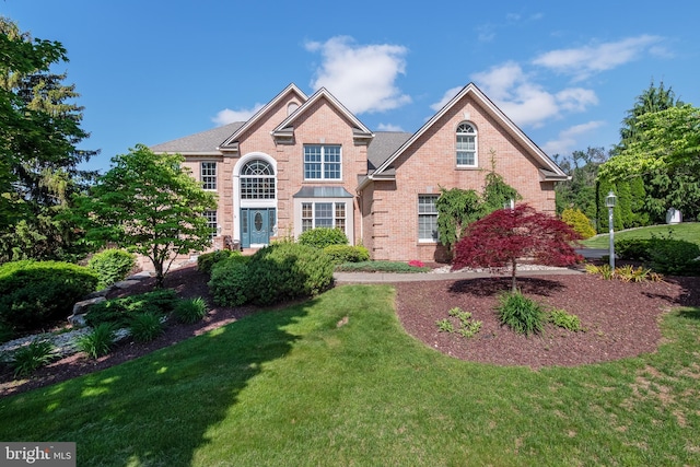 1224 Highland Dr, Orefield, PA 18069 - traditional home with a front lawn and brick siding