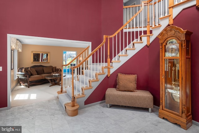1224 Highland Dr, Orefield, PA 18069 - stairway featuring a towering ceiling and baseboards