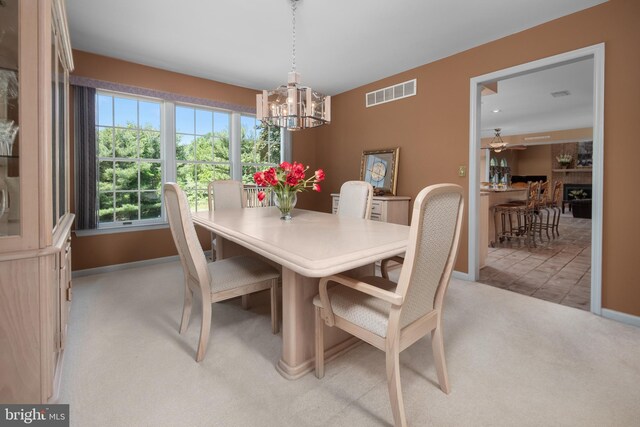 1224 Highland Dr, Orefield, PA 18069 - dining area featuring light colored carpet, a chandelier, and baseboards