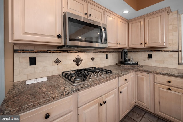 1224 Highland Dr, Orefield, PA 18069 - kitchen featuring appliances with stainless steel finishes, tasteful backsplash, dark stone counters, light brown cabinets, and recessed lighting