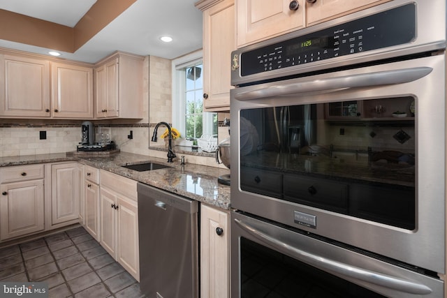 1224 Highland Dr, Orefield, PA 18069 - kitchen with a sink, stainless steel appliances, decorative backsplash, light stone counters, and recessed lighting