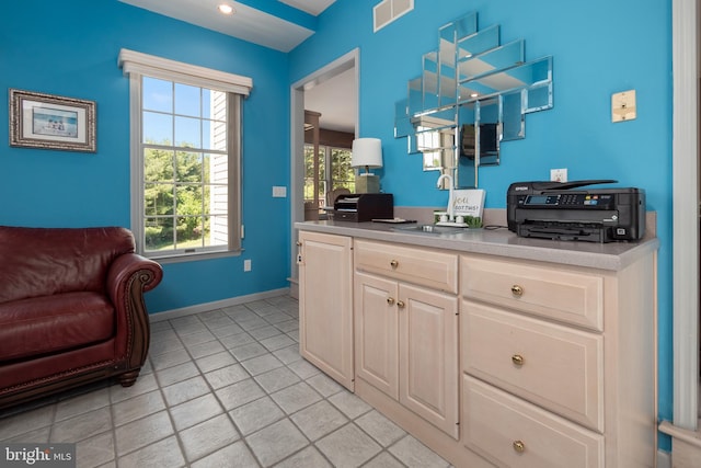 1224 Highland Dr, Orefield, PA 18069 - kitchen featuring a sink, light tile patterned floors, light countertops, and baseboards