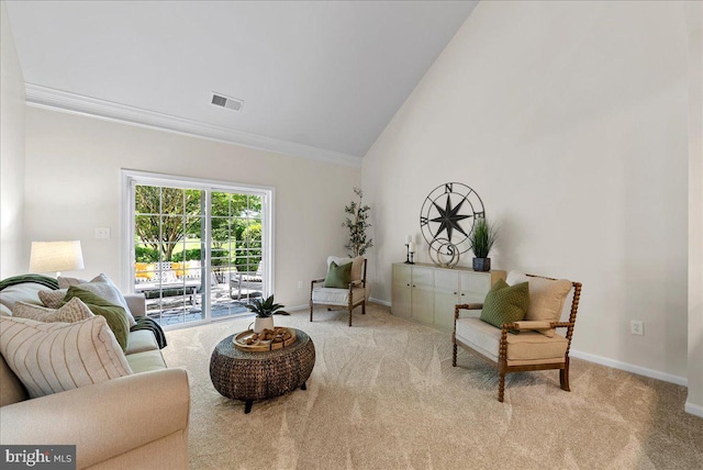 44324 Stableford Sq, Ashburn, VA 20147 - carpeted living room featuring vaulted ceiling, crown molding, and baseboards