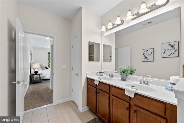 44324 Stableford Sq, Ashburn, VA 20147 - ensuite bathroom with double vanity, tile patterned flooring, and baseboards