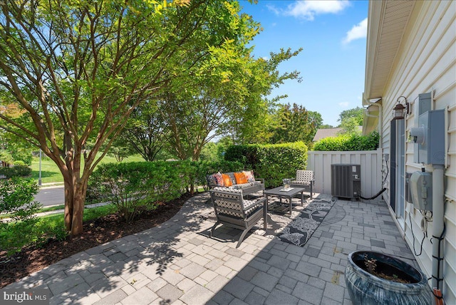 44324 Stableford Sq, Ashburn, VA 20147 - view of patio / terrace with central AC and an outdoor living space