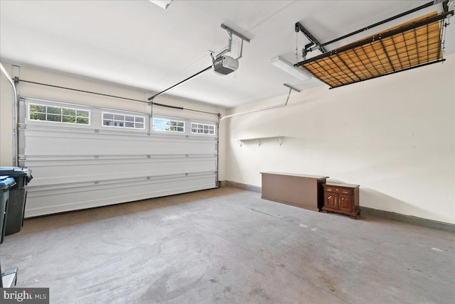 44324 Stableford Sq, Ashburn, VA 20147 - garage featuring baseboards and a garage door opener