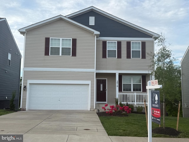 2010 Fauna Dr, Frederick, MD 21702 - traditional-style house with an attached garage, concrete driveway, covered porch, and a front lawn
