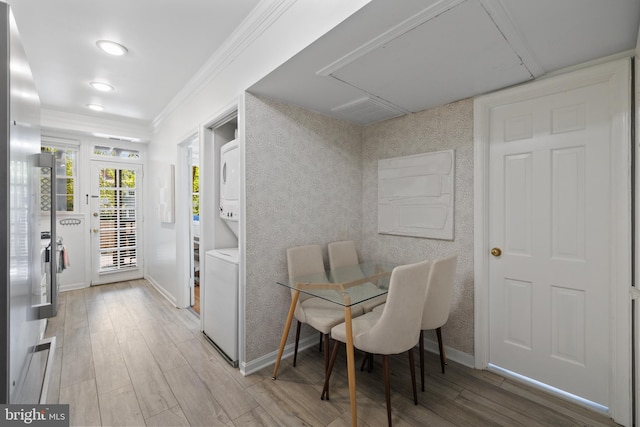 3 Russell Rd Unit 3B, Alexandria, VA 22301 - dining room with stacked washer / dryer, crown molding, wood finished floors, recessed lighting, and attic access