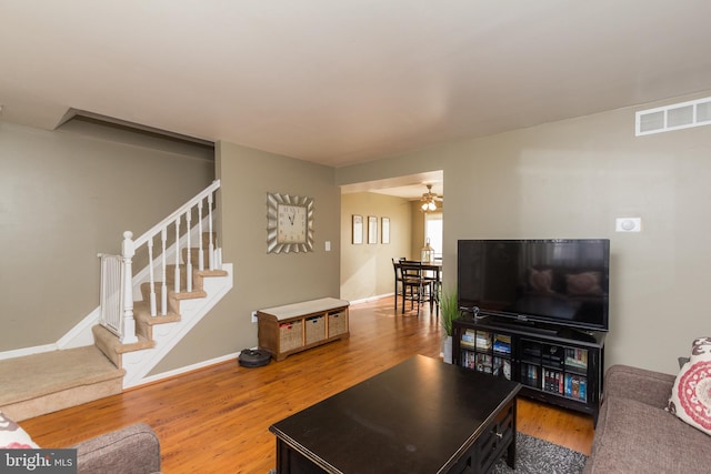 41 Luffing Ct, Baltimore, MD 21221 - living room featuring stairway, wood finished floors, baseboards, and ceiling fan