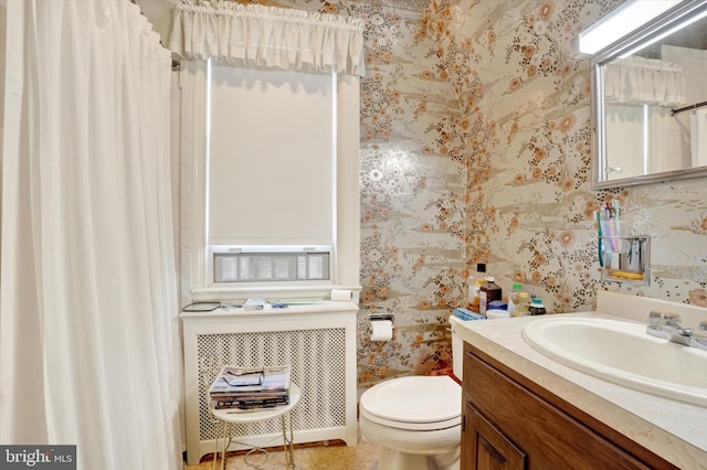 827 Pennsylvania Ave, York, PA 17404 - bathroom featuring vanity, toilet, wallpapered walls, and curtained shower