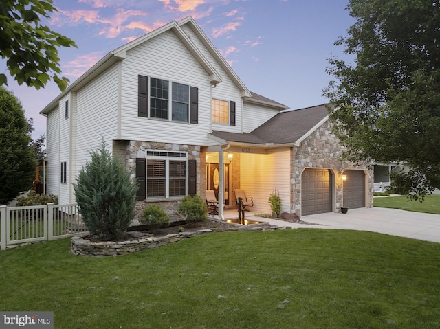 6133 Jennifer Ln, Spring Grove, PA 17362 - view of front of home with stone siding, concrete driveway, and an attached garage