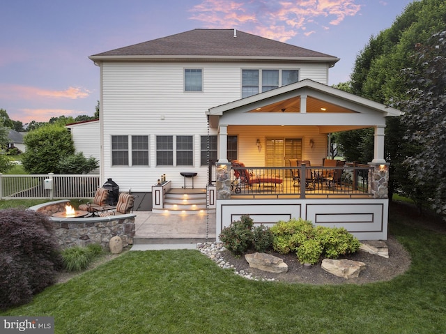 6133 Jennifer Ln, Spring Grove, PA 17362 - rear view of house featuring a fire pit, roof with shingles, and a patio area
