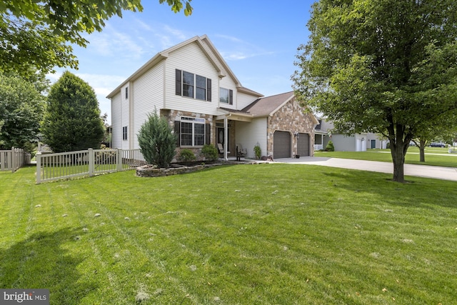 6133 Jennifer Ln, Spring Grove, PA 17362 - traditional-style home with stone siding, an attached garage, and concrete driveway