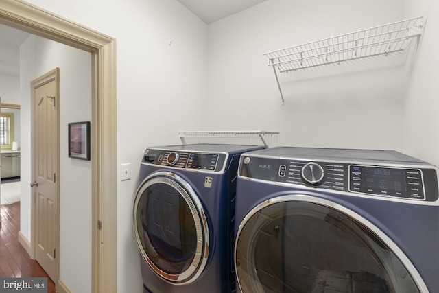 6133 Jennifer Ln, Spring Grove, PA 17362 - washroom featuring washing machine and clothes dryer, wood finished floors, and baseboards
