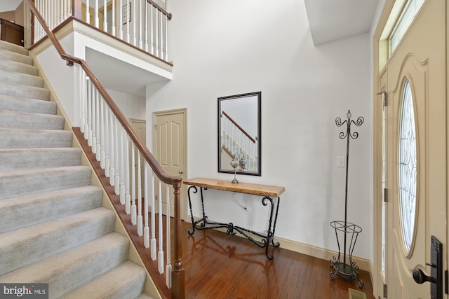 6133 Jennifer Ln, Spring Grove, PA 17362 - foyer entrance featuring wood-type flooring, baseboards, stairs, and a high ceiling