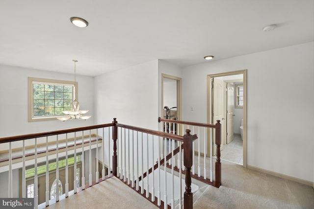 6133 Jennifer Ln, Spring Grove, PA 17362 - hall featuring an upstairs landing, a chandelier, carpet, and baseboards