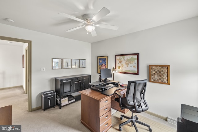 6133 Jennifer Ln, Spring Grove, PA 17362 - home office with a ceiling fan, light colored carpet, and baseboards