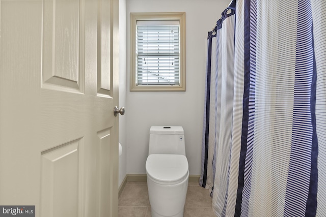 6133 Jennifer Ln, Spring Grove, PA 17362 - full bathroom featuring toilet, tile patterned floors, a shower with shower curtain, and baseboards