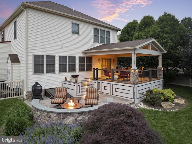 6133 Jennifer Ln, Spring Grove, PA 17362 - back of property at dusk featuring a fire pit and a yard