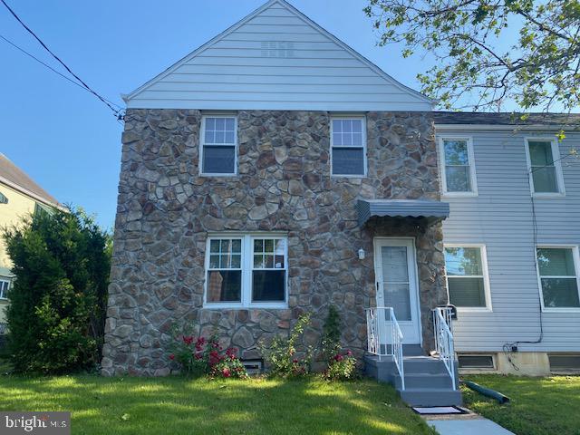 1311 Sycamore Ave, Wilmington, DE 19805 - view of front of property with stone siding and a front yard