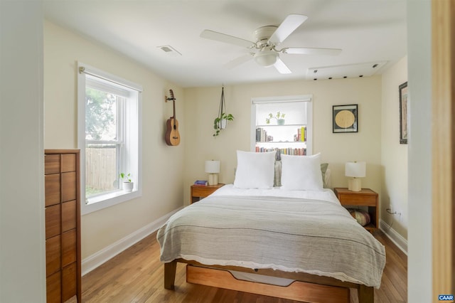 304 NW 11th St, Charlottesville, VA 22903 - bedroom featuring wood finished floors, baseboards, and a ceiling fan