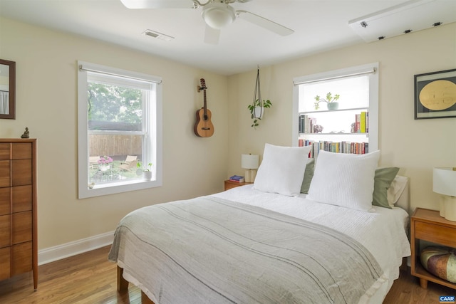 304 NW 11th St, Charlottesville, VA 22903 - bedroom featuring wood finished floors, ceiling fan, and baseboards