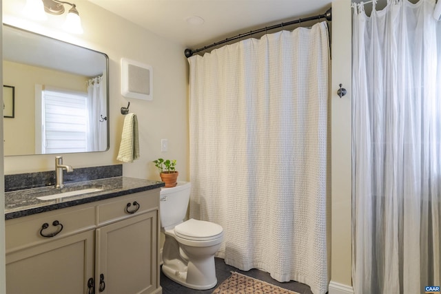 304 NW 11th St, Charlottesville, VA 22903 - bathroom with toilet, vanity, and a shower with shower curtain