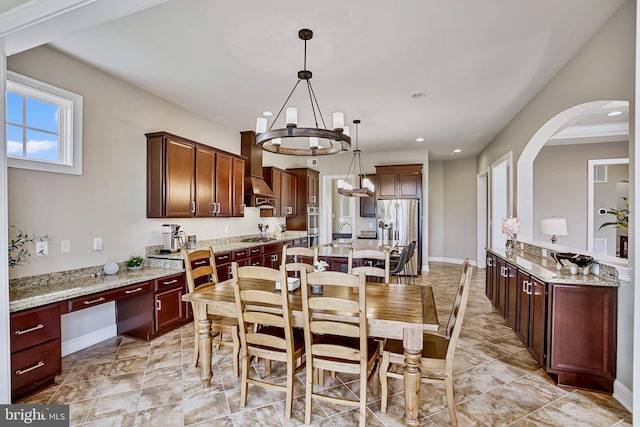 18604 Wild Raspberry Dr, Purcellville, VA 20132 - dining area featuring a chandelier, arched walkways, recessed lighting, and baseboards