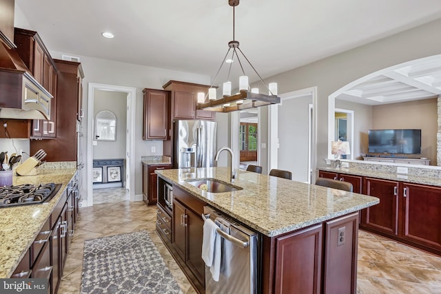 18604 Wild Raspberry Dr, Purcellville, VA 20132 - kitchen featuring stainless steel appliances, dark brown cabinets, a sink, a chandelier, and recessed lighting