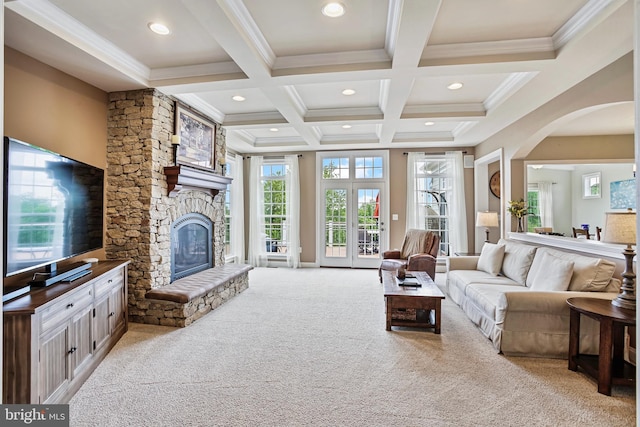 18604 Wild Raspberry Dr, Purcellville, VA 20132 - living area featuring carpet, beamed ceiling, a fireplace, plenty of natural light, and crown molding