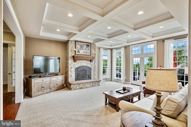 18604 Wild Raspberry Dr, Purcellville, VA 20132 - living room with coffered ceiling, beamed ceiling, french doors, a stone fireplace, and ornamental molding