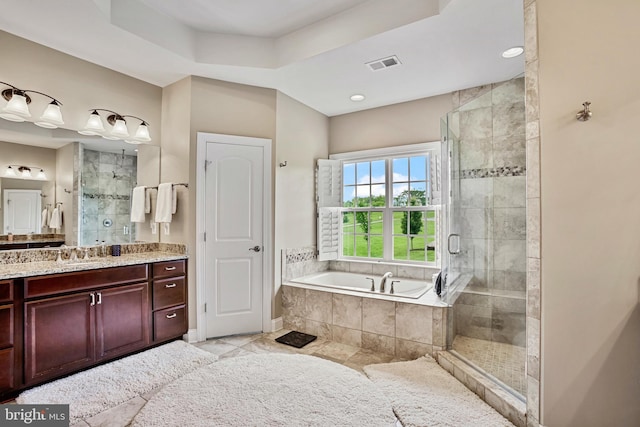 18604 Wild Raspberry Dr, Purcellville, VA 20132 - bathroom featuring a garden tub, a shower stall, vanity, tile patterned flooring, and a tray ceiling
