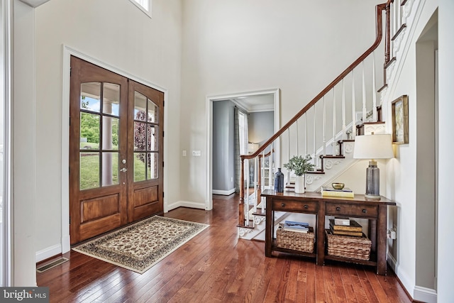 18604 Wild Raspberry Dr, Purcellville, VA 20132 - foyer with healthy amount of natural light, hardwood / wood-style floors, stairway, and a high ceiling