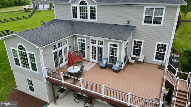 18604 Wild Raspberry Dr, Purcellville, VA 20132 - back of house featuring french doors, a deck, roof with shingles, a lawn, and outdoor dining area