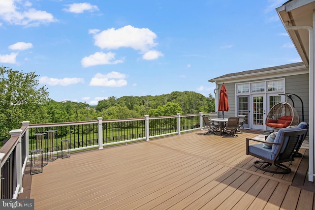 18604 Wild Raspberry Dr, Purcellville, VA 20132 - deck featuring outdoor dining space and a view of trees