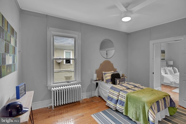 4316 9th St NW, Washington, DC 20011 - bedroom featuring radiator heating unit, wood finished floors, and ceiling fan