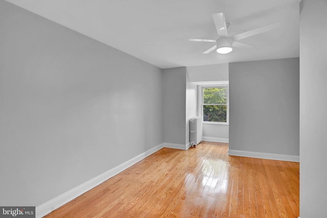 4316 9th St NW, Washington, DC 20011 - empty room featuring radiator heating unit, light wood-type flooring, baseboards, and a ceiling fan