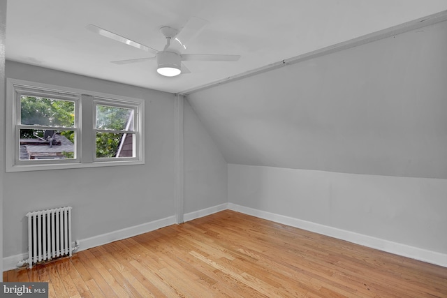 4316 9th St NW, Washington, DC 20011 - additional living space with radiator heating unit, light wood-style floors, lofted ceiling, and baseboards