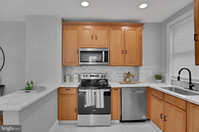 4316 9th St NW, Washington, DC 20011 - kitchen with appliances with stainless steel finishes, a sink, a peninsula, backsplash, and recessed lighting