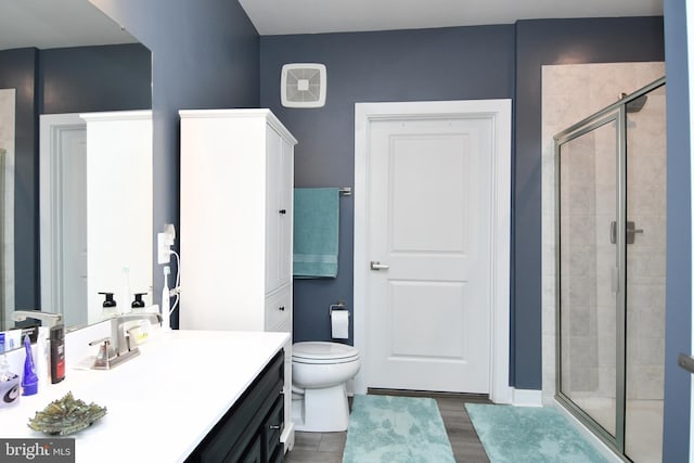 10401 Resort Rd Unit F, Ellicott City, MD 21042 - bathroom featuring vanity, a shower stall, wood finished floors, and toilet