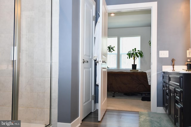 10401 Resort Rd Unit F, Ellicott City, MD 21042 - bathroom featuring ensuite bath, vanity, wood finished floors, and a shower stall