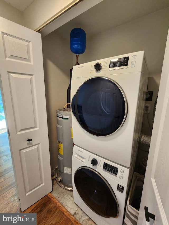 7331 Branchwood Ter, Clinton, MD 20735 - washroom featuring stacked washer / dryer, water heater, and light wood-style flooring