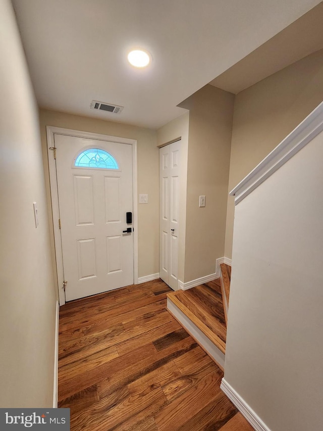 7331 Branchwood Ter, Clinton, MD 20735 - entryway featuring wood finished floors, stairway, and baseboards