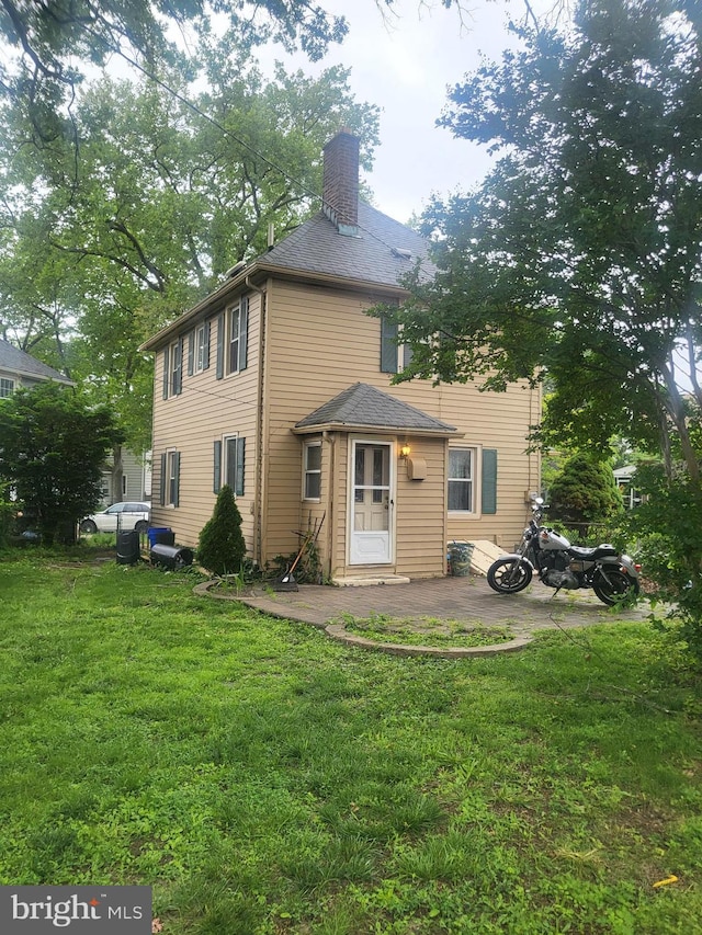 230 New Jersey Rd, Brooklawn, NJ 08030 - rear view of house with a yard, a chimney, and a patio area